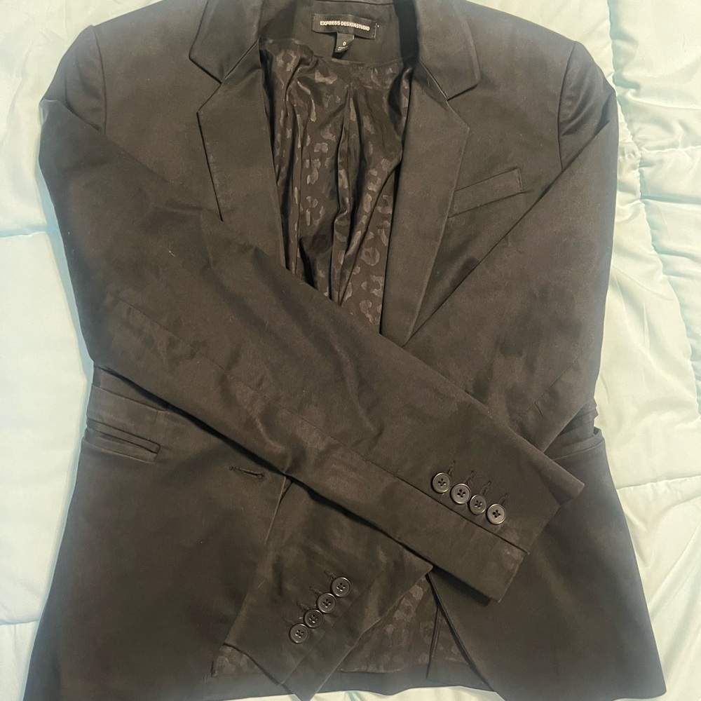 Black Blazer by Express with leopard patterns in the inside. Size 0